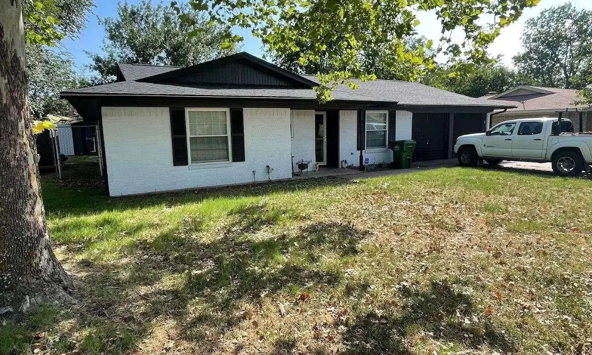 Professional roofing crew working on a residential roof in Coral Hills
